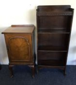 A small oak bookcase together with a bedside cabin