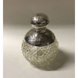 A heavy hobnail cut silver mounted scent bottle. B