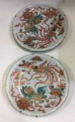 A pair of 20th Century Chinese wall plates decorat