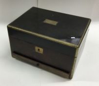 A calamander wood and brass mounted box with flush
