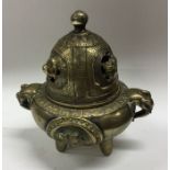 A Chinese brass censer decorated in relief with li