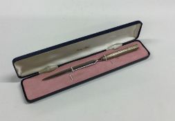 A cased silver engine turned letter opener. Approx