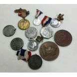 A bag containing old commemorative coins and medal