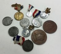 A bag containing old commemorative coins and medal