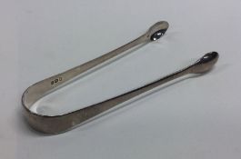 A pair of Georgian OE pattern silver sugar tongs.