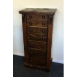 A rosewood seven drawer Wellington chest. Est. £30