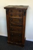 A rosewood seven drawer Wellington chest. Est. £30