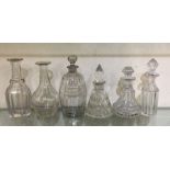 A collection of Antique cut glass bottles and stop
