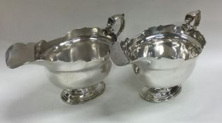 A good pair of George II style silver sauce boats