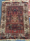 An old tapestry rug. Est. £30 - £50.