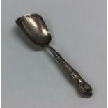 A Victorian silver caddy scoop with Kings' pattern