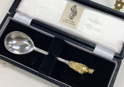 A good cast silver and silver gilt spoon in fitted