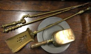 A brass companion set, pewter plates etc. Est. £10