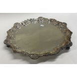 A circular silver salver. Birmingham. By FH. Appro