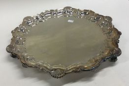 A circular silver salver. Birmingham. By FH. Appro