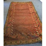 A large runner decorated in bright colours. Est. £