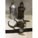 An old trench art oil lamp together with a First World War German belt etc. Est. £30