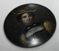 A circular papier-mâché miniature of a lady with h