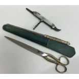 A pair of silver plated travelling scissors togeth