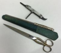 A pair of silver plated travelling scissors togeth