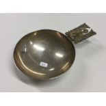 A good heavy silver bleeding bowl with gilt handle