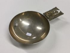 A good heavy silver bleeding bowl with gilt handle