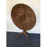 A good mahogany hinged top table with carved decor