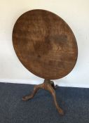 A good mahogany hinged top table with carved decor