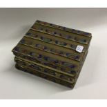 A Chinese enamel and brass cigarette box decorated