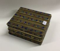 A Chinese enamel and brass cigarette box decorated