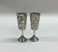 A pair of Russian pierced silver goblets decorated