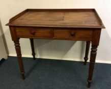 A Victorian mahogany two drawer desk. Est. £30 - £