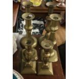 Three pairs of brass candlesticks. Est. £20 - £30.