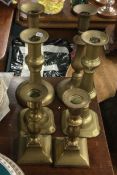 Three pairs of brass candlesticks. Est. £20 - £30.