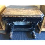 A carved oak single drawer hall table with stretch