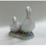 A Royal Copenhagen figure of two geese. Est. £10 -
