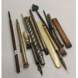 A gilt metal extending pencil etc. Est. £20 - £30.