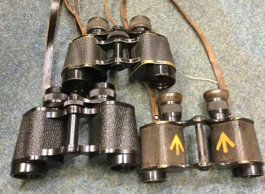 Three pairs of leather cased binoculars. Est. £30