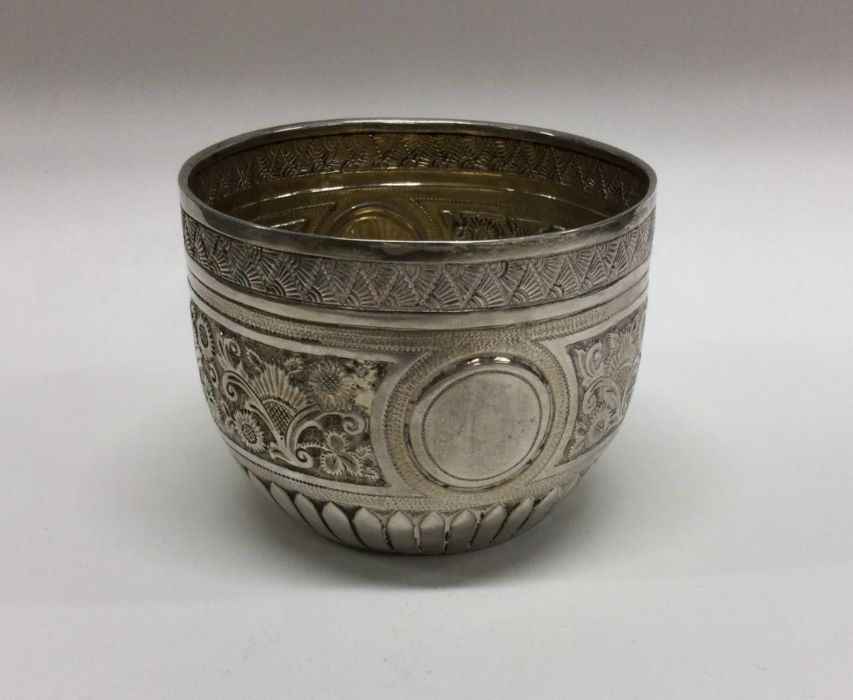 An attractive chased silver sugar bowl decorated w