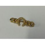 An attractive Victorian gold horseshoe brooch with