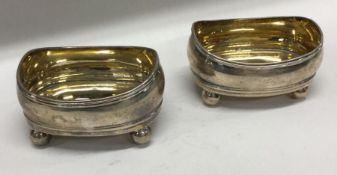 A good pair of crested silver and silver gilt salt