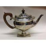 An Edwardian silver teapot on pedestal base. Birmi