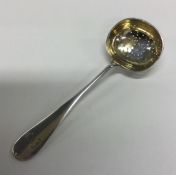 A Russian silver and silver gilt straining spoon w