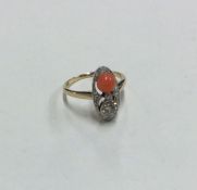 A stylish Art Deco style coral and diamond ring se