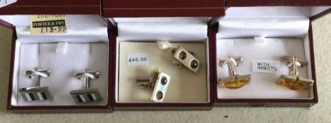 Three cased pairs of silver cufflinks. Est. £15 -