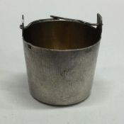 A Russian silver tea infuser with swing handle to
