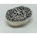 A stylish silver oval potpourri decorated with hin