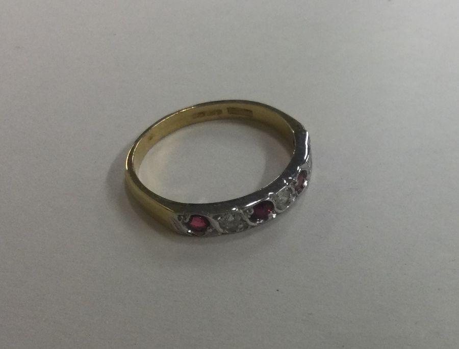 A ruby and diamond seven stone ring in 18 carat go - Image 3 of 3