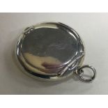 A plain silver miniature compact with hinged top.