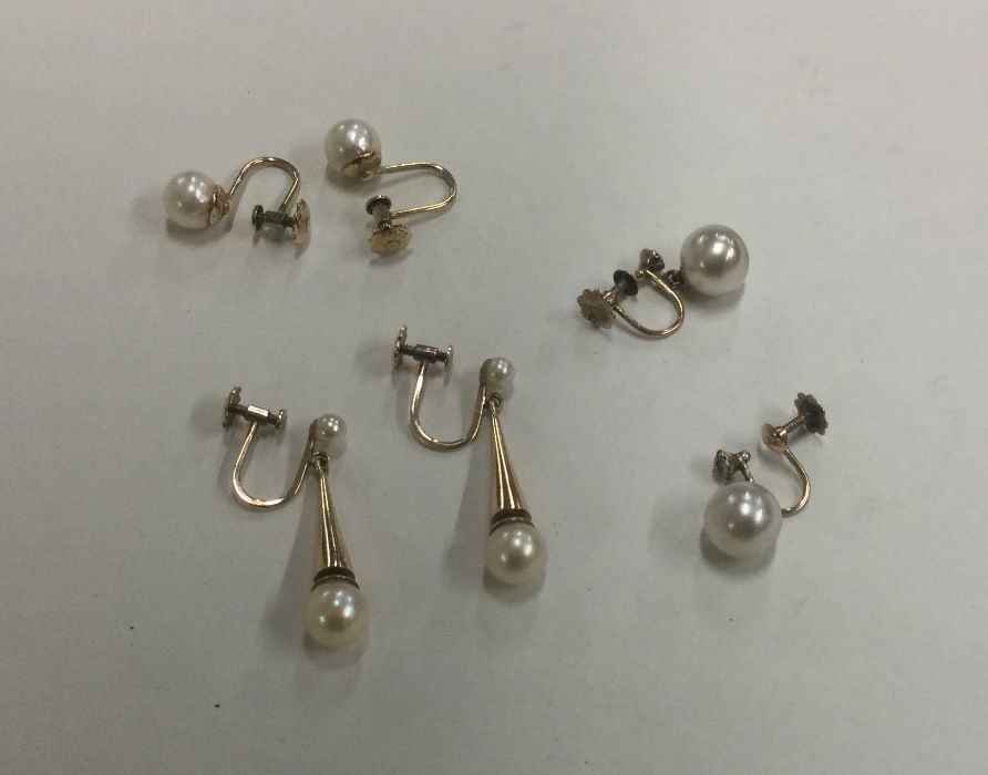 A collection of gold mounted pearl earrings. Est.
